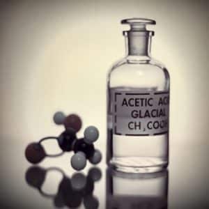 Production of formic acid from acetic acid